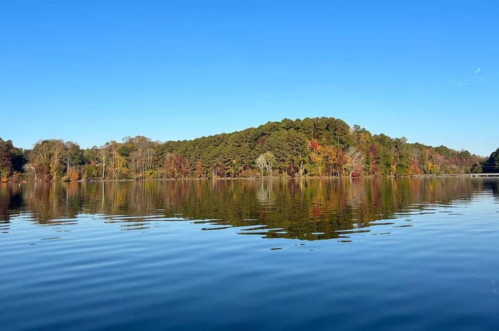 Who manages stormwater at the University Lake dam?